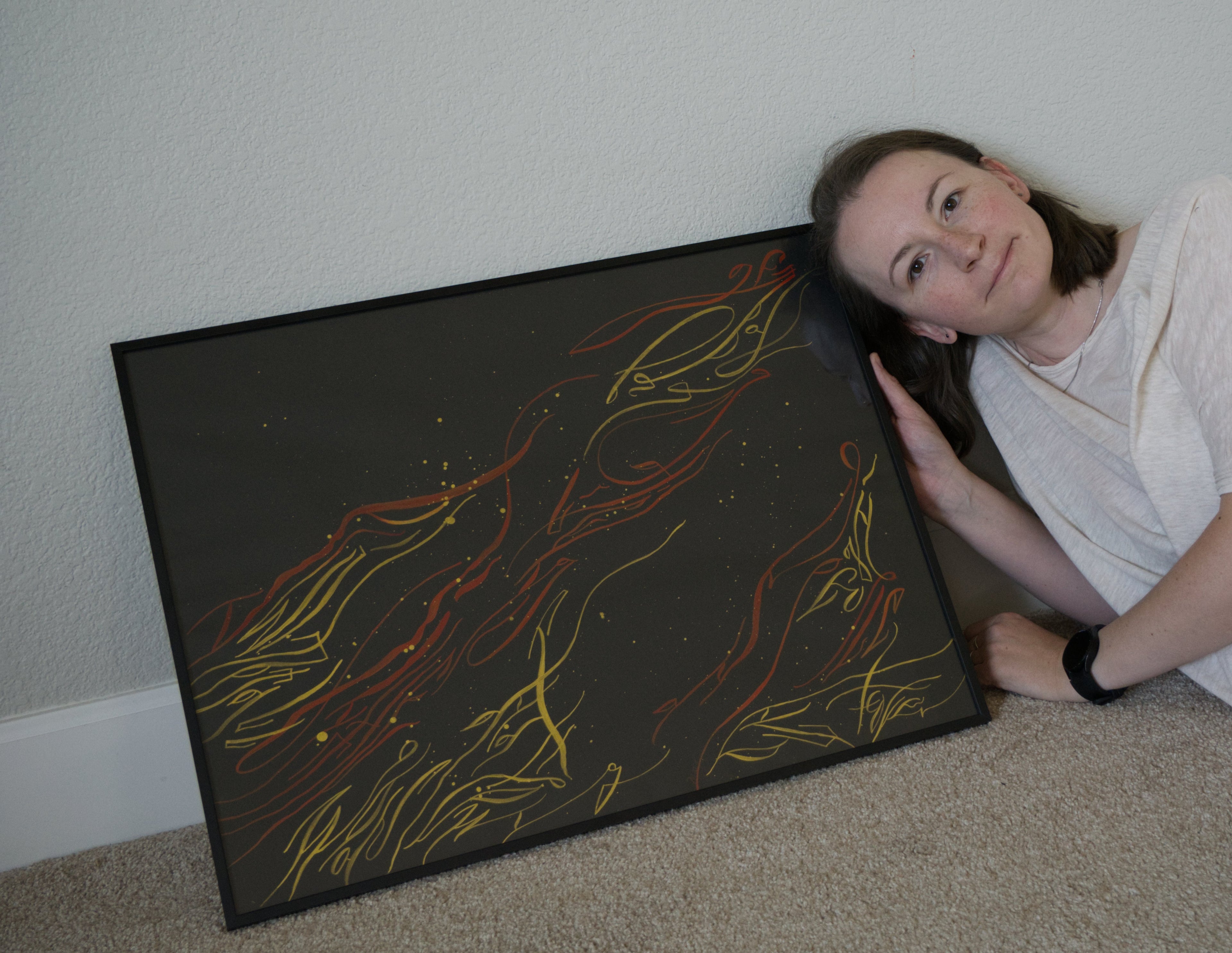 Mary Pavlova with here artwork The flame of frustration