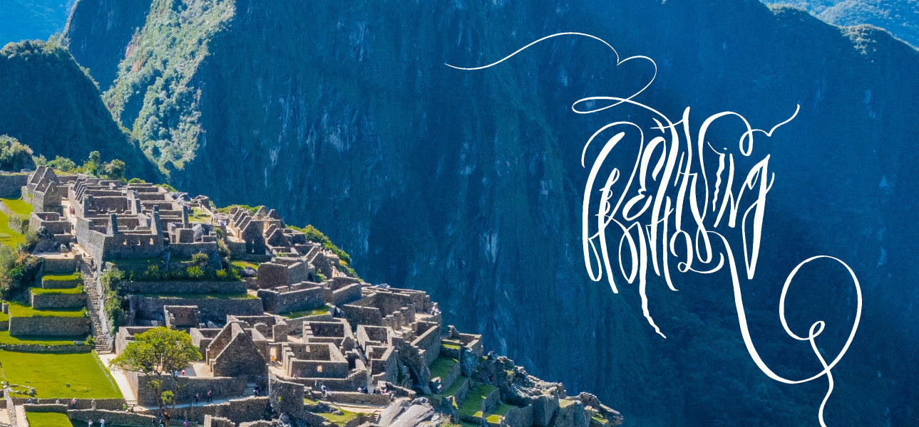A minimal white calligraphy artwork "Breathtaking" on a background of picture with Machu Pichu