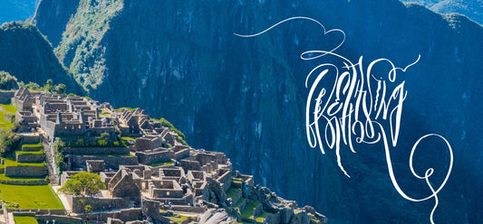 A minimal white calligraphy artwork "Breathtaking" on a background of picture with Machu Pichu