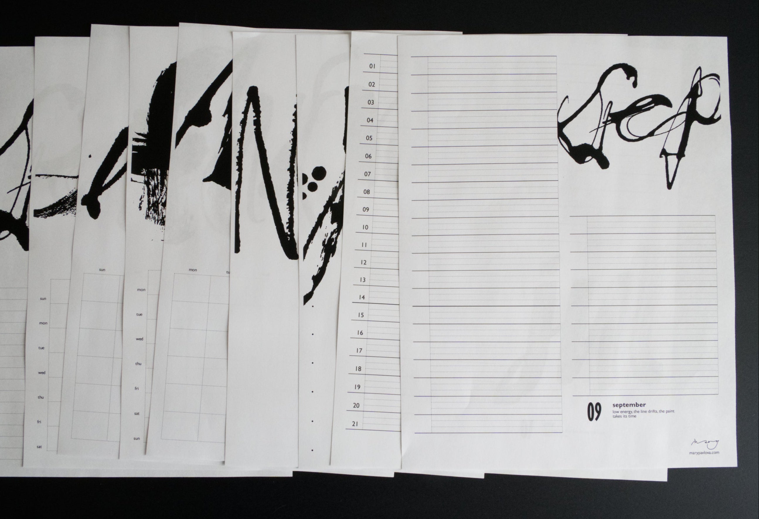 Set of calendar layouts sheets with black text and designs on a dark background