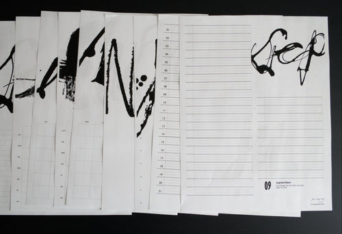 Set of calendar layouts sheets with black text and designs on a dark background