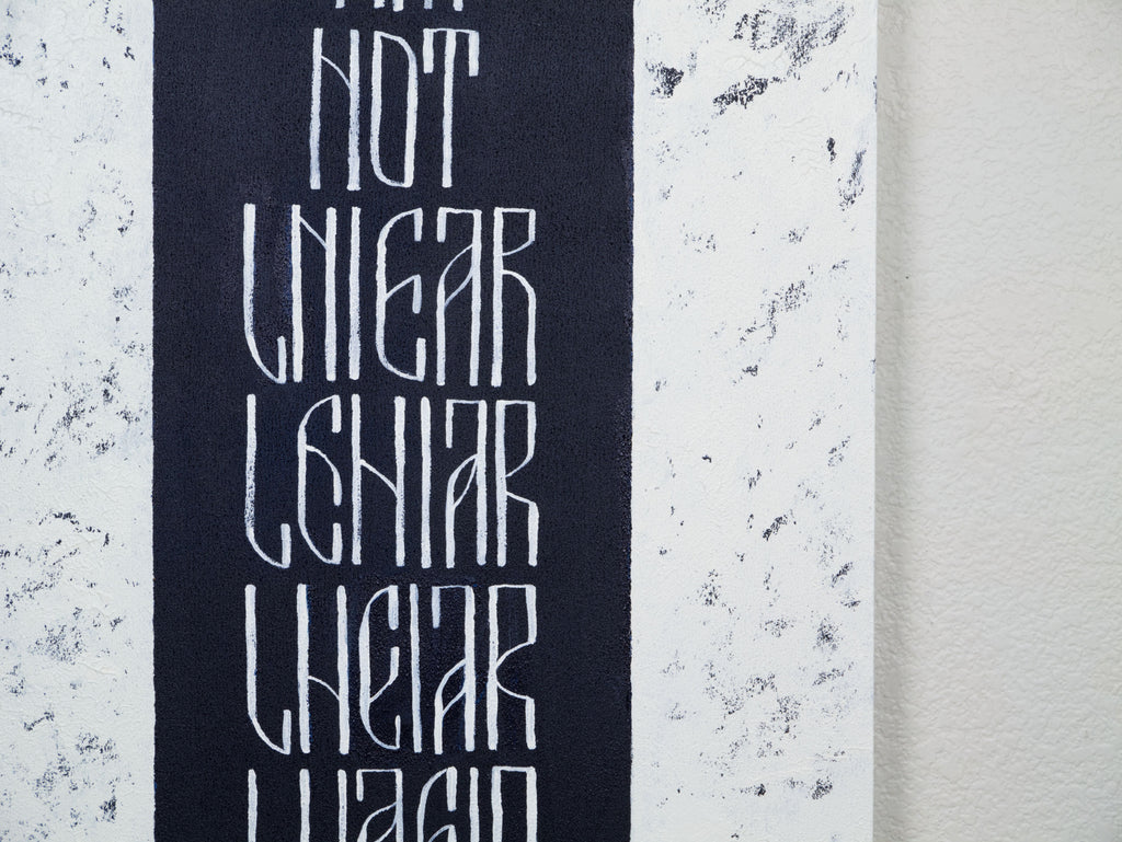 Detail of I Am Not Linear original text-based artwork  in dark blue and white  by Mary Pavlova