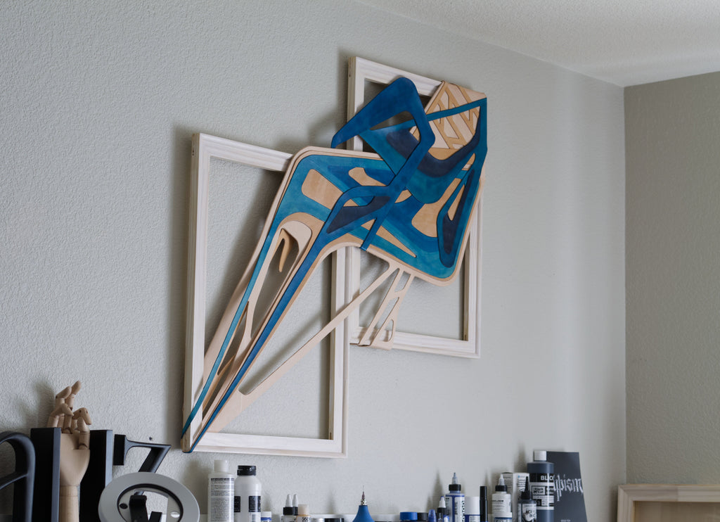 Signatrue stlye original abstract text-based artwork in blue and beige by Mary Pavlova, displayed in an interior